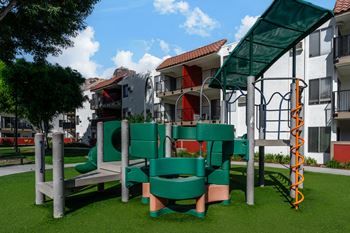 a playground with a building in the background